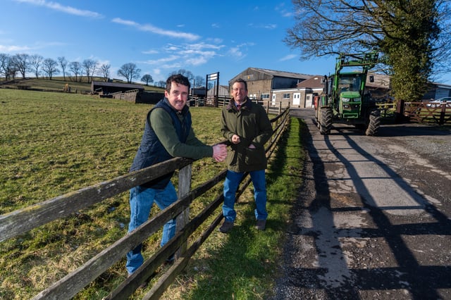 Farmer David Coates, of Pot Haw, Farm near Gargrave, with his son Harry. Picture: James Hardisty