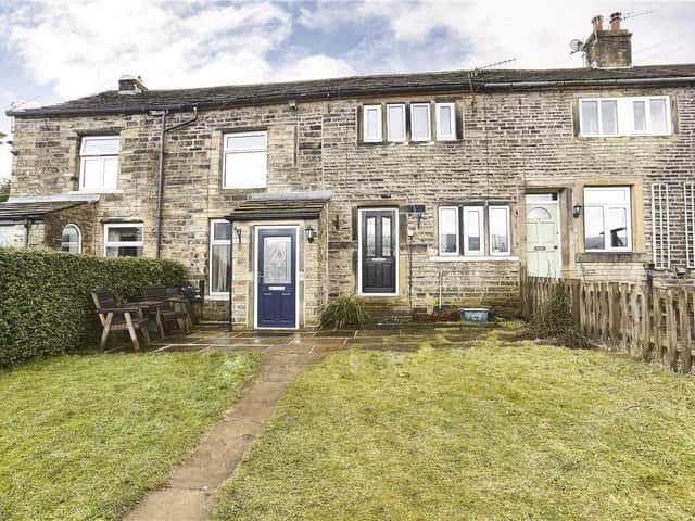 This two-bedroom  cottage at Elms Hill, Slaithwaite, is £135,000 with www.ryder-dutton.co.uk