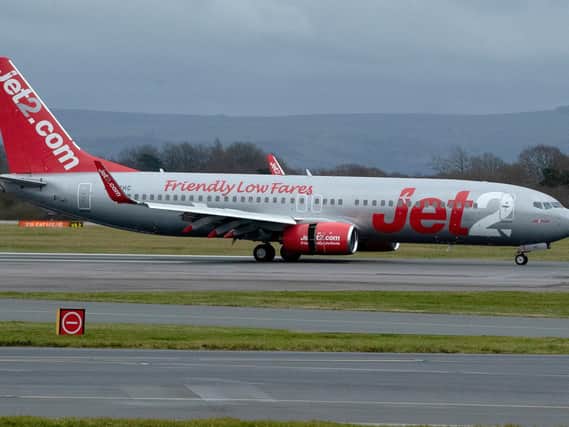 Library image of a Jet2 plane landing at Manchester Airport