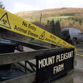 Tape on the entrance at Mount Pleasant Farm near Thirsk in North Yorkshirefrom 2002, close to where initial results of tests on a suspected new case of foot-and-mouth were announced, as negative. Photo: PA