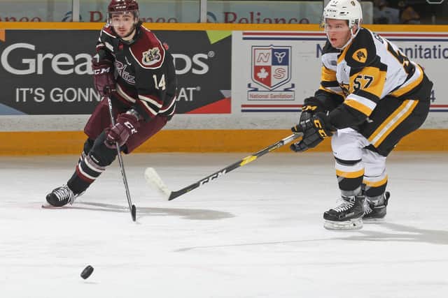 Liam Kirk, left, in action for the Peterborough Petes against Hamilton Bulldogs. Kirk hopes to see some action in North America. Picture: Claus Andersen/Getty Images