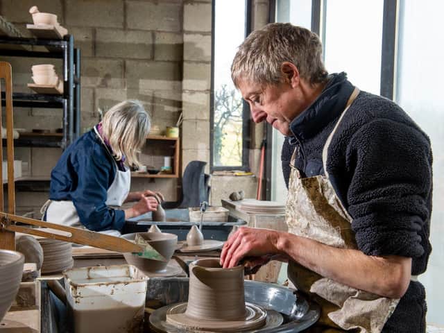 Lee Cartledge and his mother Kathy at work in their pottery studio
