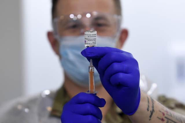 Opening of the new vaccination centre at Elland Road, Leeds. Sgt Phil Morris from the Royal Regimental Aid Post 4th Battalion, Scottish Regiment, prepares the AstraZeneca vaccine on February 8. Picture by Simon Hulme.