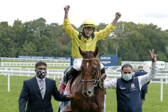 Tom Marquand celebrates Addeybb's win in last October's Qipco Champion Stakes at Ascot.