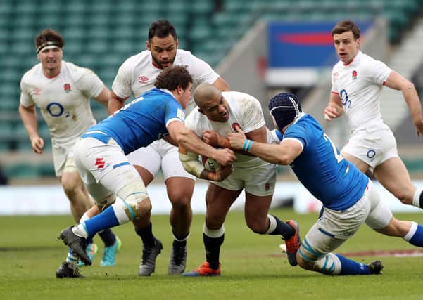 On the charge: England's Kyle Sinckler is tackled by Italy's Luca Bigi and Michele Lamaro. Pictures: David Davies/PA
