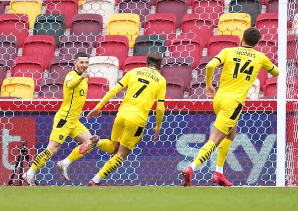 goal: Barnsley’s Conor Chaplin celebrates scoring his side’s first goal of the game with team-mates at Brentford in the Championship yesterday. Picture: John Walton/PA