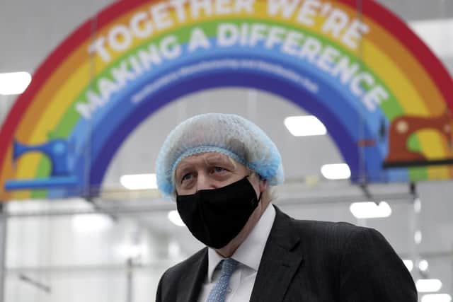 Prime Minister Boris Johnson, wearing a face mask, during a visit to a PPE manufacturing facility in Seaton Delaval (photo: PA).