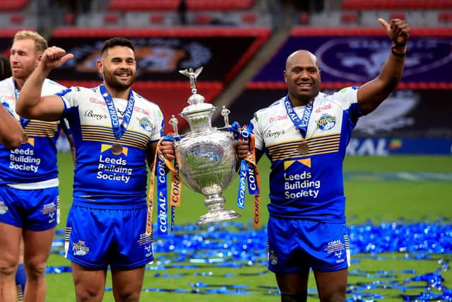 SILVERWARE: Leeds Rhinos' Rhyse Martin and Robert Lui (right) with the trophy after winning the Coral Challenge Cup Final at Wembley Stadium, London. Picture: Mike Egerton/PA Wire.