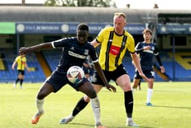 BIG MIX: Harrogate Town's Mark Beck, right, could be in line to face former club Carlisle United tonight. Picture: Steven Paston/PA