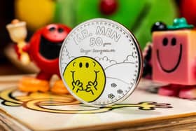 The Royal Mint unveils a new £5 Mr Happy coin, which launches today to celebrate 50 years of the Mr Men and Little Miss characters. The coin is one of three from the commemorative collection, with a Little Miss Sunshine coin and a Little Miss Giggles and Mr Strong coin due for release later this year. Ciaran McCrickard/PA Wire