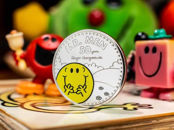 The Royal Mint unveils a new £5 Mr Happy coin, which launches today to celebrate 50 years of the Mr Men and Little Miss characters. The coin is one of three from the commemorative collection, with a Little Miss Sunshine coin and a Little Miss Giggles and Mr Strong coin due for release later this year. Ciaran McCrickard/PA Wire