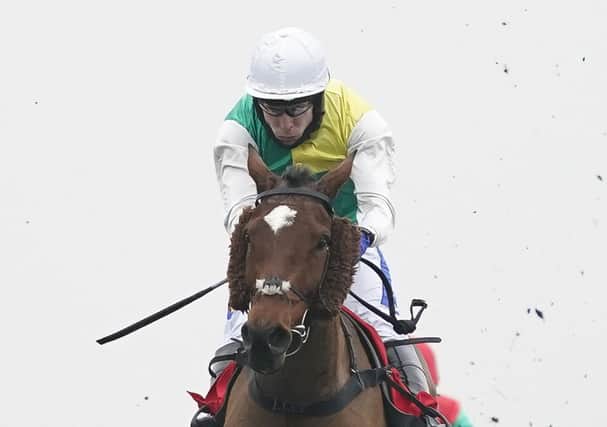 This was Grand National contender Cloth Cap winning the Ladbrokes Trophy at Newbury under Tom Scudamore.