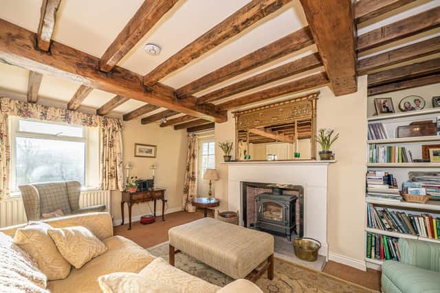 The cosy sitting room with original beams