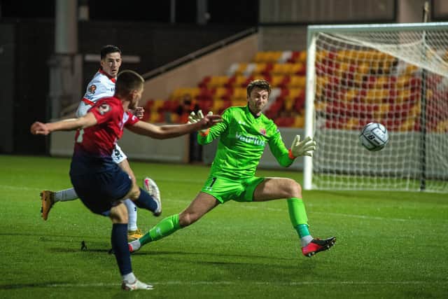 Gavin McGill fires a shot in past Chris Neal.
York City v AFC Fylde at the LNER Community Stadium
 (Picture: Bruce Rollinson)