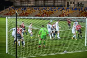 crowded box, empty stands: Matty Brown, centre, sees his header cleared by the AFC Fylde defence as the visitors pooped York’s new stadium party. (Picture: Bruce Rollinson)