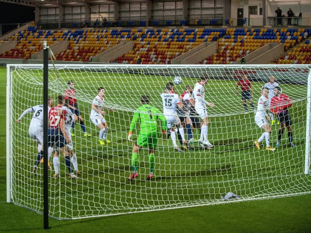 crowded box, empty stands: Matty Brown, centre, sees his header cleared by the AFC Fylde defence as the visitors pooped York’s new stadium party. (Picture: Bruce Rollinson)