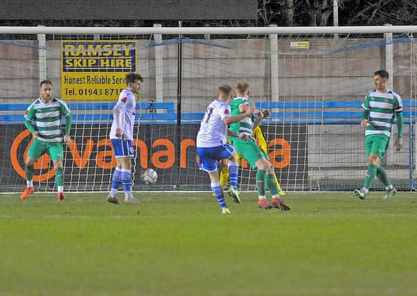 NO GO: Action from the November derby between Guiseley and Farsley at Nethermoor. Picture: Steve Riding.