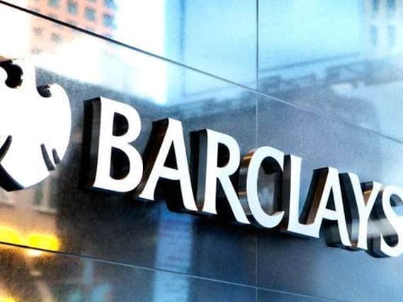 Barclays unveiled a shareholder dividend payout despite the profits hit