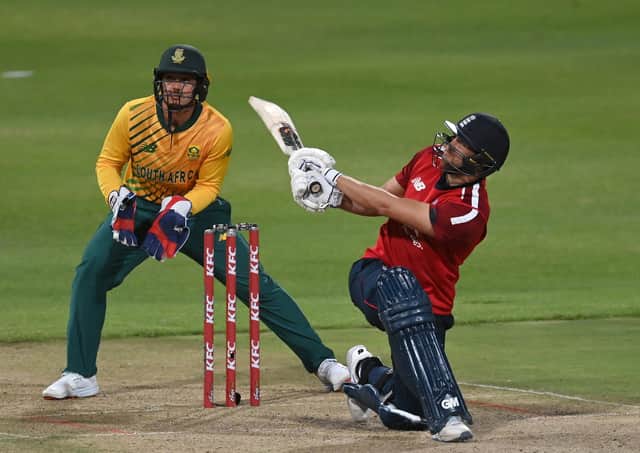 YOU'RE IN: Yorkshire's Dawid Malan smashes a six as South Africa wicketkeeper Quinton de Kock looks on during the 3rd Twenty20 International between South Africa and England at Newlands in December. Picture: Shaun Botterill/Getty Images)