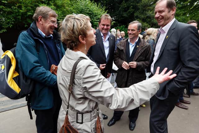 Tour de France Director Christian Prudhomme (right) and former five times winner Bernard Hinault (second right), along with Gary Verity (centre), CEO of Welcome to Yorkshire, speak to cycling enthusiasts during a visit the Yorkshire Garden at the RHS Chelsea Flower Show, London in 2013. Picture: PA