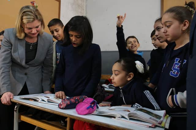 Justine Greening (left), during a tour of the Bourj Hammoud School, a mixed school teaching Lebanese and Syrian children in Beirut, Lebanon, to see how the UK's response and aid is helping the refugee crisis in January 2016.