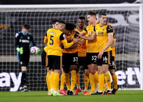 Wolverhampton Wanderers' players celebrate after Leeds United goalkeeper Illan Meslier scores an own goal. Pictures: PA.