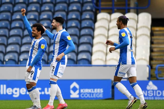 ALL SMILES: Duane Holmes celebrates after scoring for Huddersfield Town against Swansea City. Picture: Jonathan Gawthorpe.