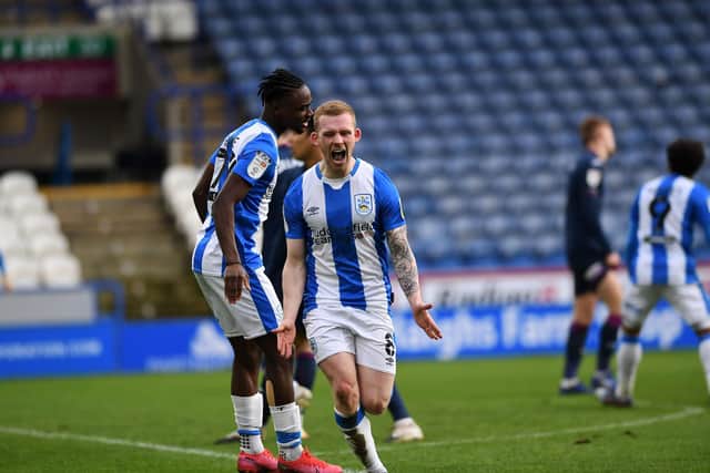 KEY MOMENT: Lewis O'Brien celebrates after regaining the lead for Huddersfield Town against Swansea City. Picture: Jonathan Gawthorpe.