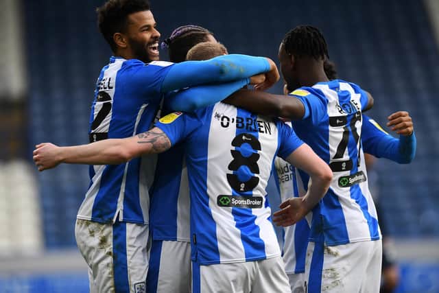 VICTORY: Huddersfield Town players celebrate during their 4-1 win over Swansea City. Picture: Jonathan Gawthorpe.