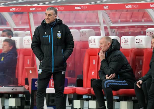 FOCUSSED: Sheffield Wednesday caretaker boss Neil Thompson consults Lee Bullen during Tuesday night's 1-0 defeat at Stoke City. Picture: Steve Ellis