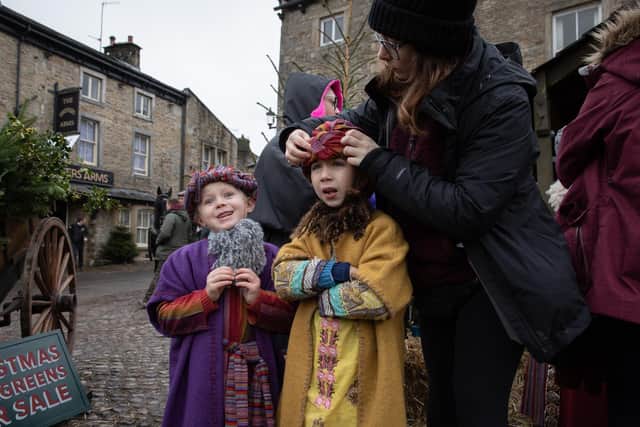 Children getting outfitted on set in Grassington which plays Darrowby in C5's All Creatures Great and Small