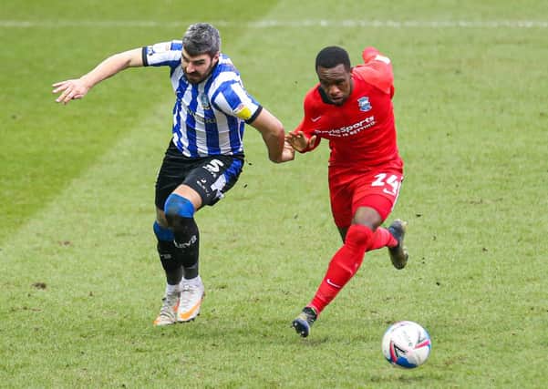 Sheffield Wednesday's Callum Paterson (left) and Birmingham City's Rekeem Harper battle for the ball. Picture: PA.