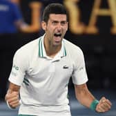 Victory: Serbia's Novak Djokovic celebrates after defeating Russia's Daniil Medvedev in the men's singles final. Picture: AP Photo/Andy Brownbill