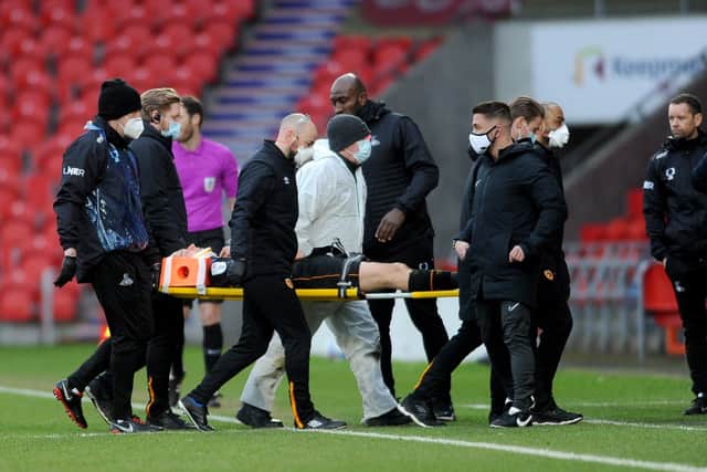 Injury blow: Hull City's George Honeyman is stretchered off. Picture: Simon Hulme
