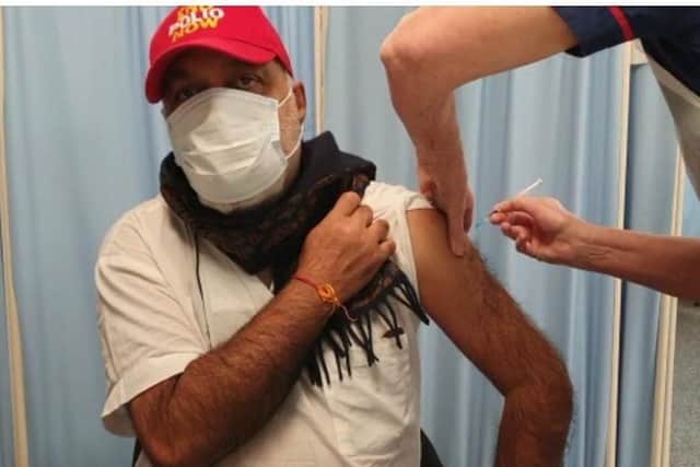 Manoj Joshi receiving his first Covid vaccination.