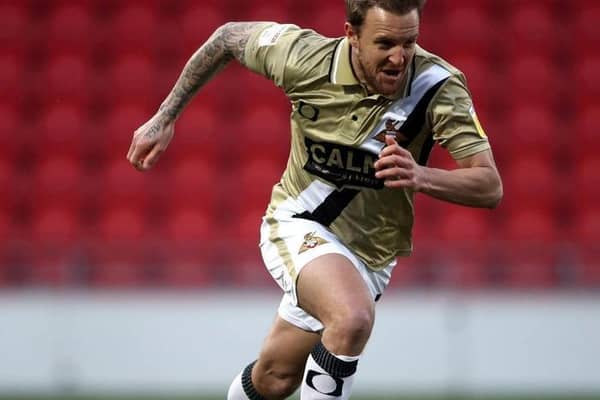 Hero: Doncaster Rovers' James Coppinger celebrates making it 3-3. Picture: PA