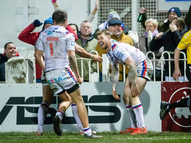 BACK: Wakefield Trinity's Tom Johnstone celebrates after scoring against Hull FC in their last Super League home game in front of crowds at Belle Vue on March 6 last year. (ALLAN MCKENZIE/SWPIX)