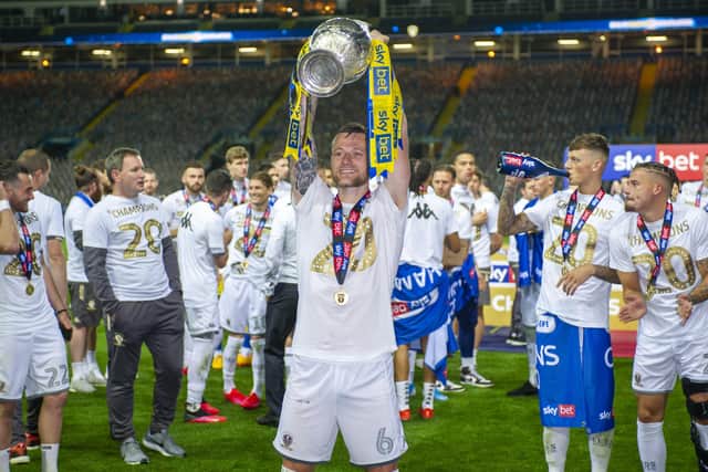 CHAMPION MOMENT: Captain Liam Cooper lifts the Championship trophy at Elland Road celebrating the promotion to the Premier League that comes with it. Picture: Tony Johnson
