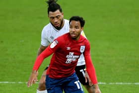 Huddersfield Town's Demeaco Duhaney (front) and Derby County's Colin Kazim-Richards battle for the ball. Picture: PA.