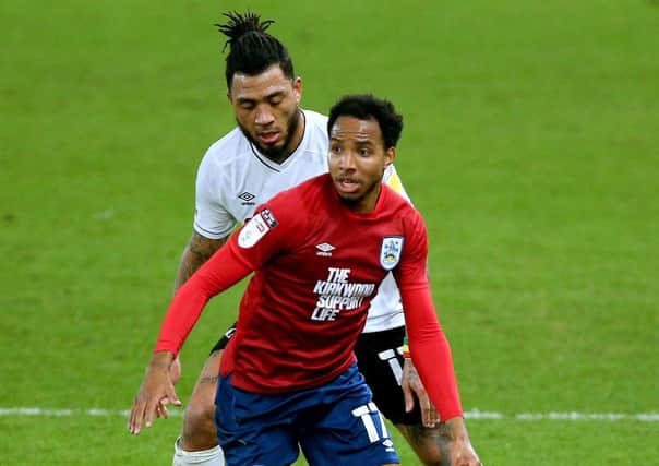 Huddersfield Town's Demeaco Duhaney (front) and Derby County's Colin Kazim-Richards battle for the ball. Picture: PA.