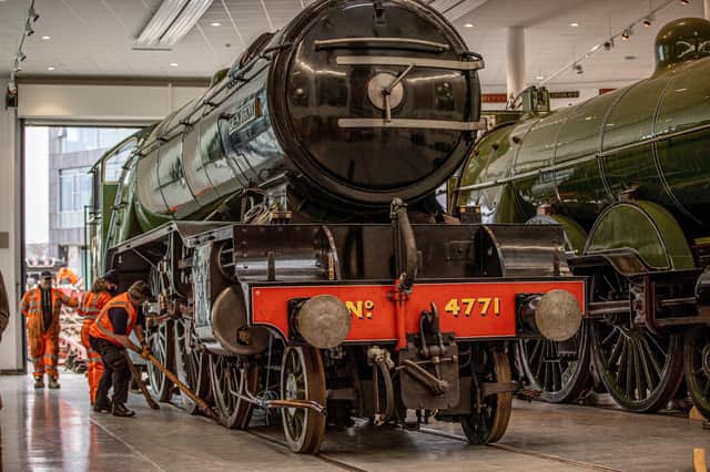 Colleagues of the National Railway Museum install The Steam Locomotive Green Arrow into the Danum Gallery Library and Museum at Doncaster. Photo:  Charlotte Graham of  CAG Photography.