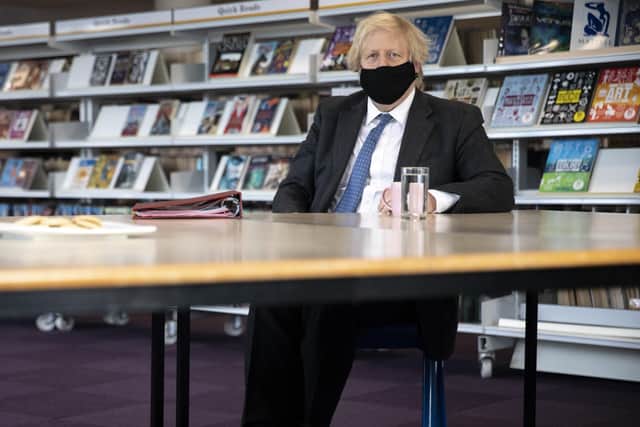 Prime Minister Boris Johnson meeting teachers in the library during a visit to Sedgehill School in Lewisham, south east London, to see preparations for students returning to school.