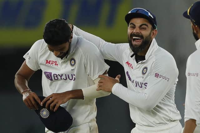India captain Virat Kohli and Washington Sundar celebrate another England wicket on day two in Ahmedabad. Picture courtesy of Saikat Das / Sportzpics for BCCI (via ECB).
