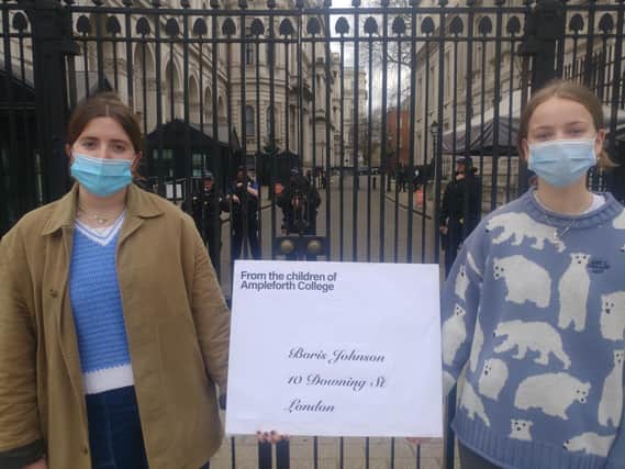 Cicely Craston and Serena Hopkins, both 17, handed head girl Ida Bridgeman's letter to Boris Johnson to Downing Street staff