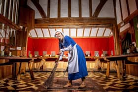 Jo Willcox, who works at Barley Hall in York, is seen dressed as a, medieval servant cleaning the Great Hall, hoping that soon they will be able to have visitors return. Image courtesy of Charlotte Graham ©2020 CAG Photography Ltd