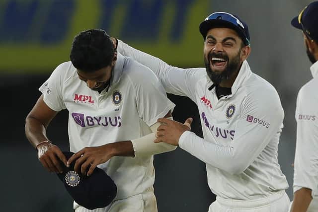 HIGH TIMES: Virat Kohli and Washington Sundar celebrate another England wicket on day two in Ahmedabad. Picture courtesy of Saikat Das / Sportzpics for BCCI (via ECB).
