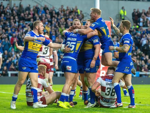 Leeds are due to play Wigan at Headingley for the first time since June, 2019, in round three. Rhinos celebrate Trent Merrin's try in that game. Picture by Bruce Rollinson.
