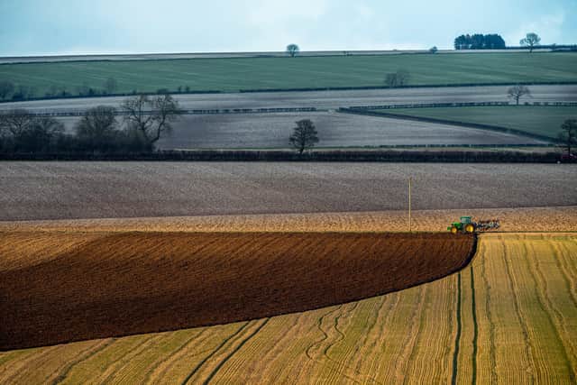 A farmer ploughs a field during the early evening sun on The Wolds near Huggate, East Yorkshire. 
Picture: James Hardisty.