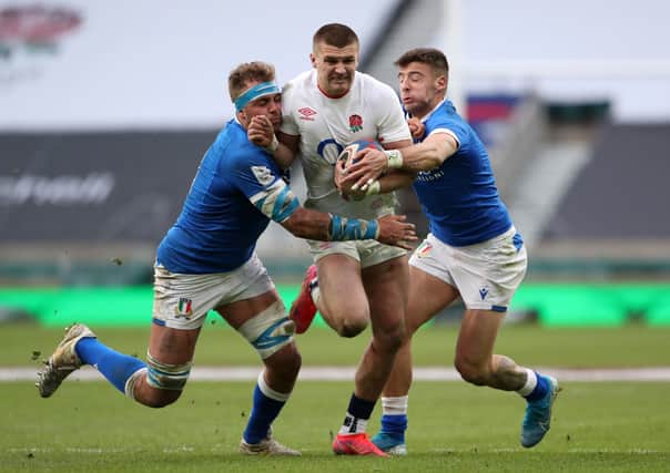 England's Henry Slade is tackled by Italy's Niccolo Cannone and Luca Sperandio during the Guinness Six Nations. Picture: PA.