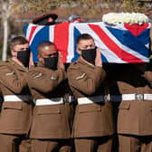 The coffin of Captain Sir Tom Moore is carried by members of the armed forces during his funeral at Bedford Crematorium. PIC: Joe Giddens/PA Wire